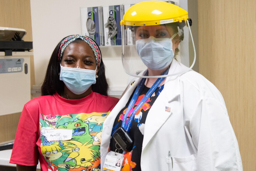 Waterloo, Iowa resident Aquarius Bunch is with Dr. Sharon Beth Larson of the University of Iowa Hospitals and Clinics during a follow-up appointment in June.