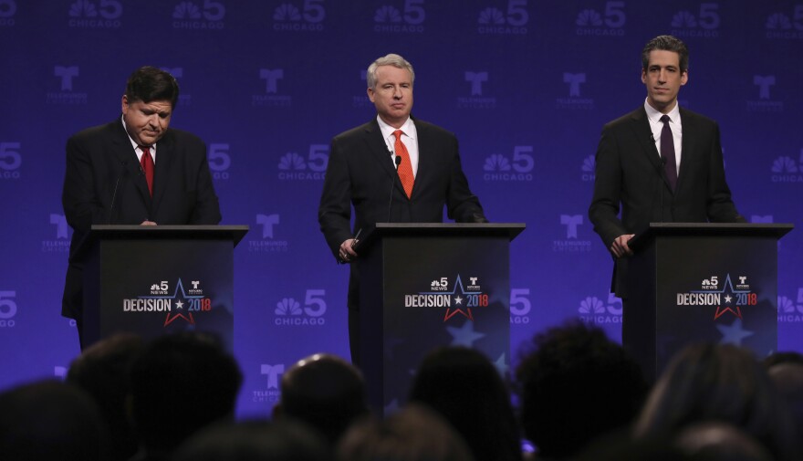 Democrats running for Illinois governor from left, billionaire J.B. Pritzker, businessman Chris Kennedy, and state Sen. Daniel Biss take their podium positions before a televised forum in January.