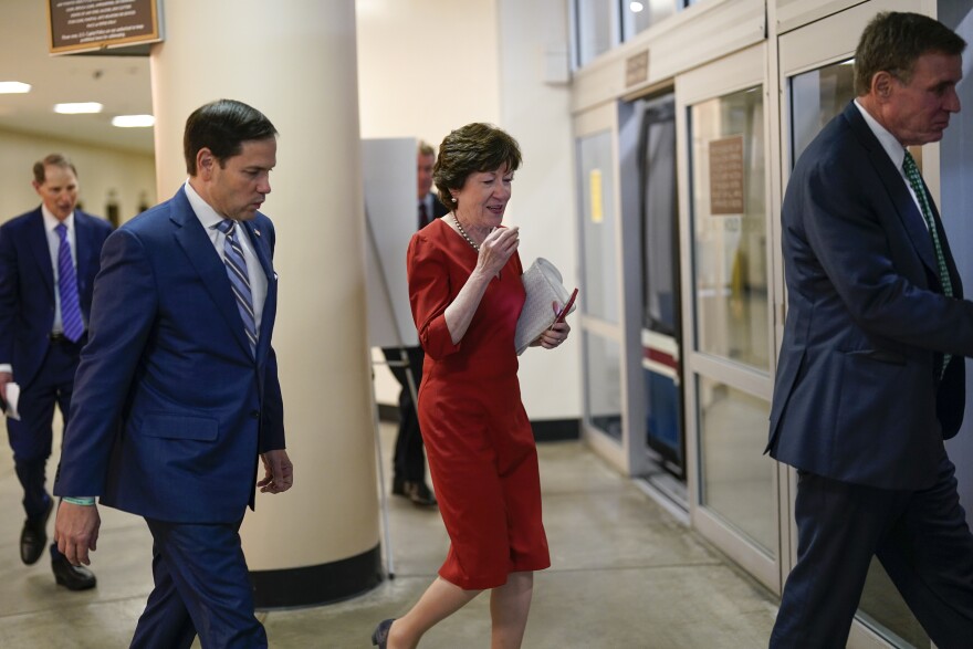 Sen. Marco Rubio, R-Fla., center left, walks with Sen. Susan Collins, R-Maine, center, as they are flanked by Sen. Ron Wyden, D-Ore., far left, and Sen. Mark Warner, D-Va., right, as they head to the chamber to vote, at the Capitol in Washington, Wednesday, June 22, 2022.