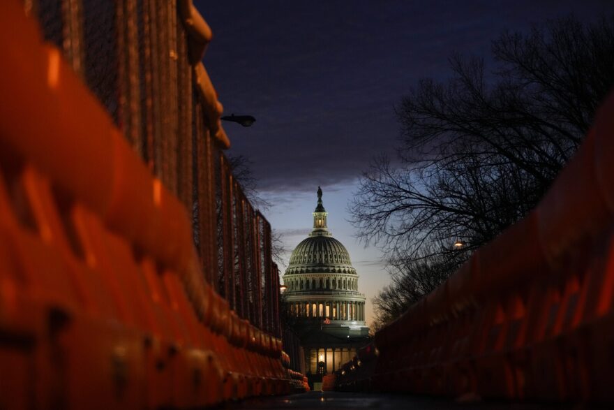 A view of the U.S. Capitol down East Capitol Street at sunset in Washington, DC.