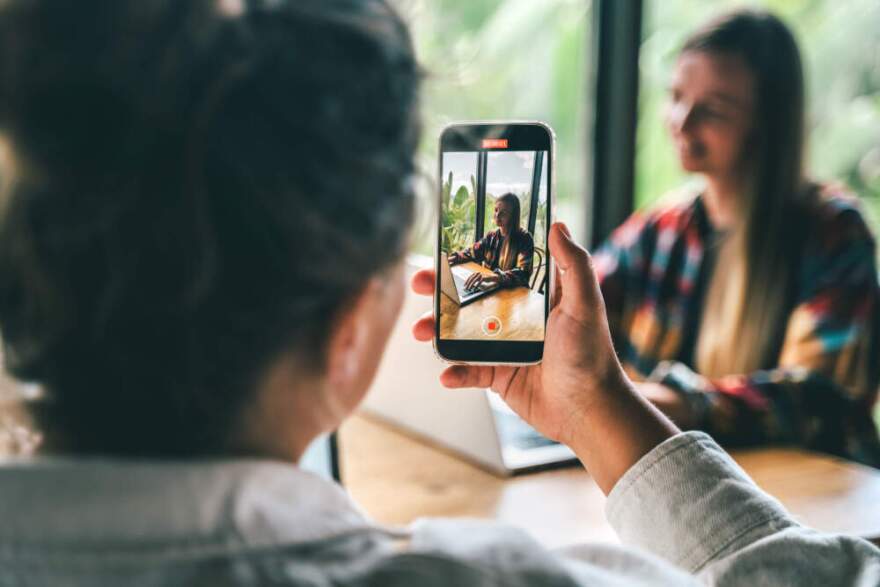 Two bloggers create a vertical video. (Yana Iskayeva/Getty Images)