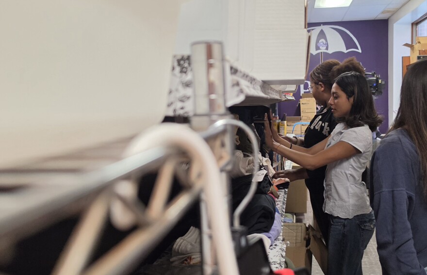Students stock pants in the in-school pantry at East Stroudsburg High School South.