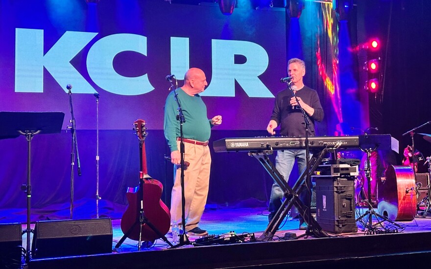 KCUR personalities Chuck Haddix (left) and Steve Kraske speak during a live broadcast of Fish Fry at Knuckleheads on Saturday, Nov. 8, 2025.