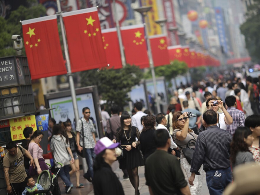 A crowd strolls on a pedestrian street during a recent holiday in Shanghai.