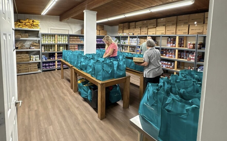 Volunteers with Food Raising Friends put together food bags for students.