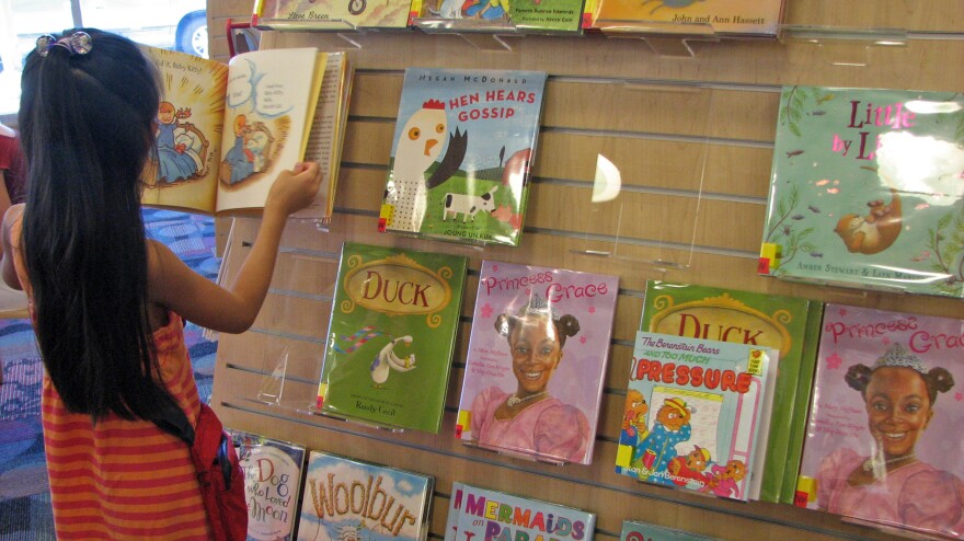 At a San Jose, Calif. library, a young reader browses a shelf of books featuring a variety of main characters: ducks, hens, white kids, black kids. Libraries help drive demand for children's books with nonwhite characters, but book publishers say there aren't enough libraries to make those books best-sellers.