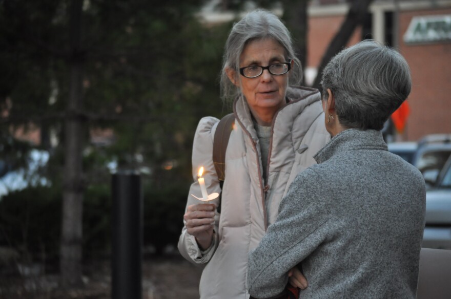 Connie Lamka holds a candle during a vigil for nine St. Lousians who died while homeless in 2015. Lamka is a case worker for the New Life Evangelistic Center, and knew two women who passed away this year. 