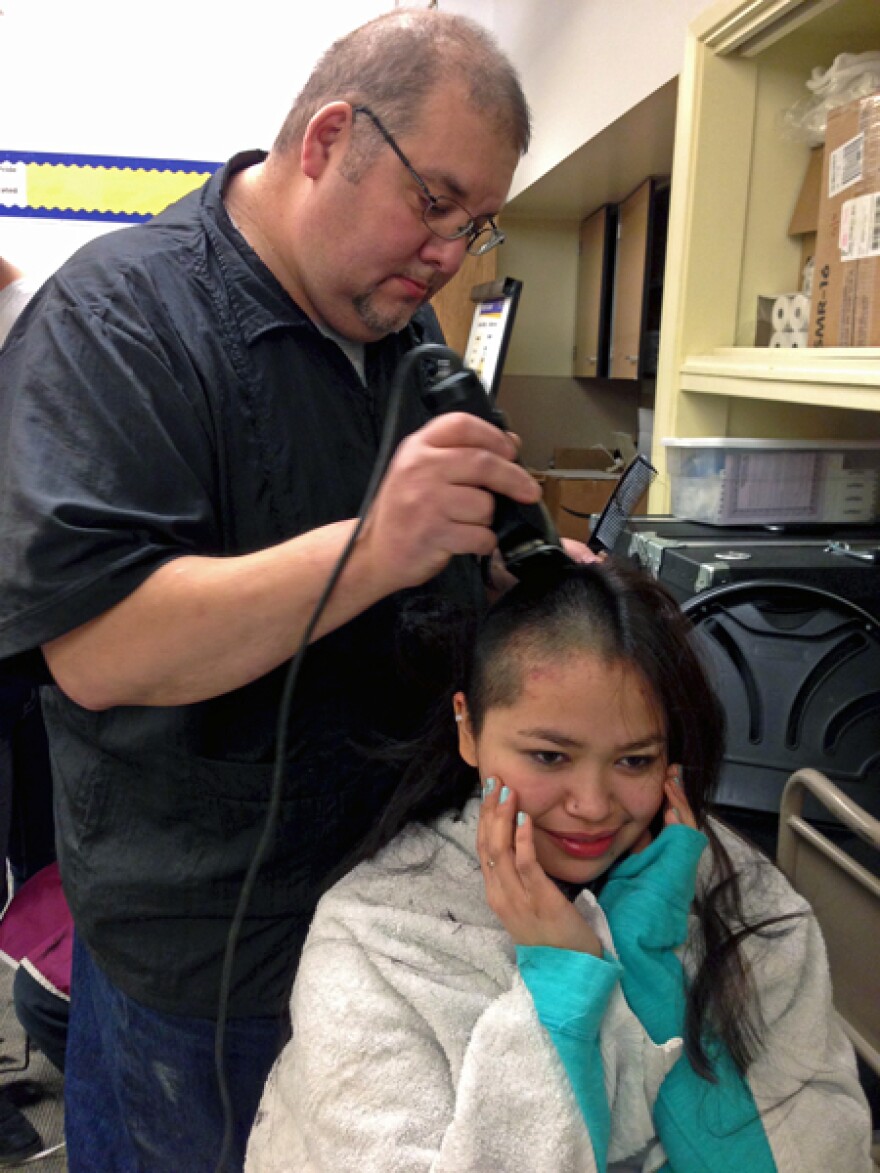 16-year-old Brenda Woods of Bethel buzzes her hair in support of KLA teacher Connie Sankwich who is undergoing chemotherapy. Photo by Angela Denning Barnes, KYUK - Bethel.