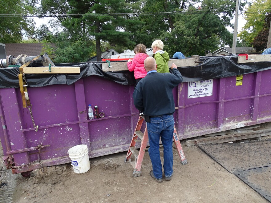The Davison twins take a peek at water from the deep aquifer that will fuel their municipal drinking water system. Now in kindergarten, they've only ever drunk bottled water.