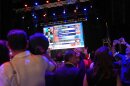 Attendees watch a screen as election results roll in during a primary election night event for Abdul El-Sayed, Tuesday, Aug. 4, 2026, at the Majestic Theatre in Detroit. (AP Photo/Julia Demaree Nikhinson)
