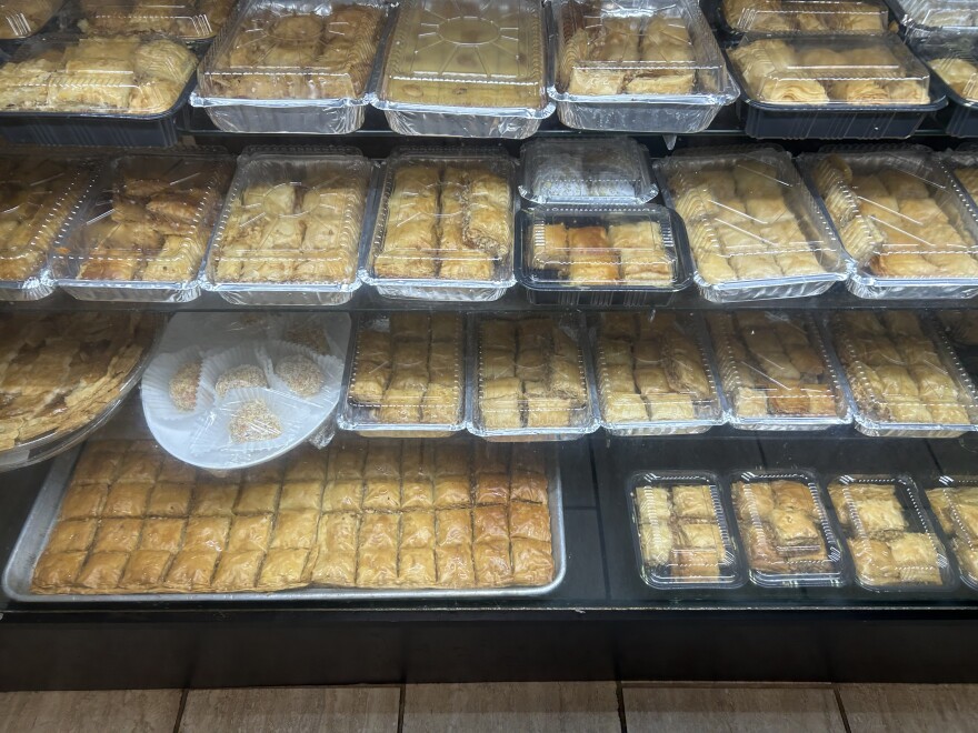 A display case filled with trays of baklava.