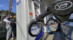 A motorist pumps gasoline at United Oil gas station in Los Angeles Friday, Aug. 12, 2022. The average U.S. price of regular-grade gasoline plummeted 45 cents over the past two weeks to $4.10 per gallon. Industry analyst Trilby Lundberg of the Lundberg Survey said Sunday, Aug. 14, 2022, that the continued decline comes as crude oil costs also remain low. (AP Photo/Damian Dovarganes)