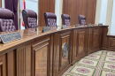 The Florida Supreme Court's bench with the visible nameplates of Justices John D. Couriel, Charles T. Canady and Chief Justice Carlos G. Muñiz on Nov. 3, 2025. (Carlton Gillespie/WLRN)