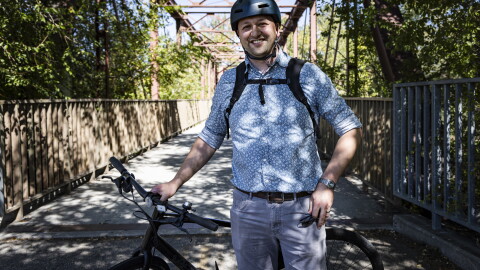 Bike commuter Bryan Bennion on his way to work on the Boise River Greenbelt. He says he's saved a lot of money in recent years by biking instead of driving.