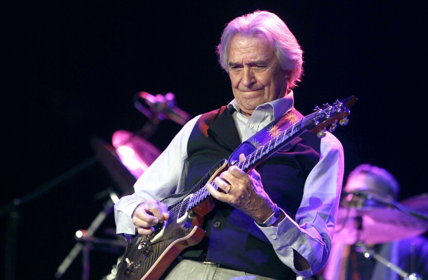 John McLaughlin, an English guitarist and leading jazz musician, performs in the Universal Hall in Skopje, Macedonia, Saturday, Nov. 22, 2014. McLaughlin performed Saturday with his 4th Dimension fusion quartet. (AP Photo/Boris Grdanoski)