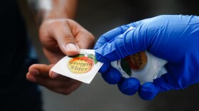 A man receives an "I'm a Georgia Voter" sticker after casting a ballot in Georgia's primary election on June 9, 2020, in Atlanta, Georgia. (Elijah Nouvelage/Getty Images)