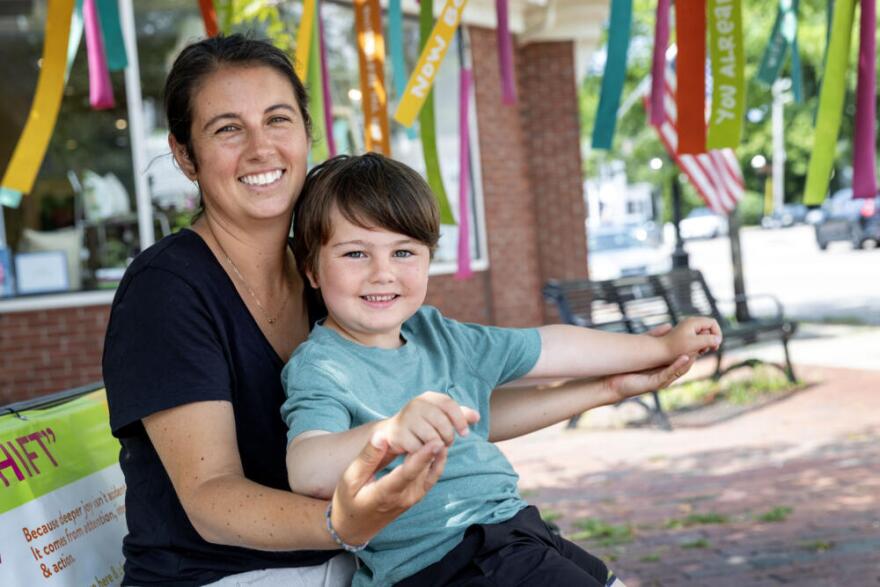 Meaghan Rogers and her son Bode, on North Street in Hingham, Mass. (Robin Lubbock/WBUR)