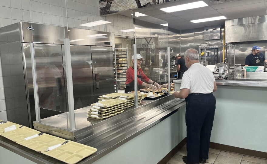 A volunteer serves a patron at the newly renovated St. Francis of Assisi Kitchen in Scranton.
