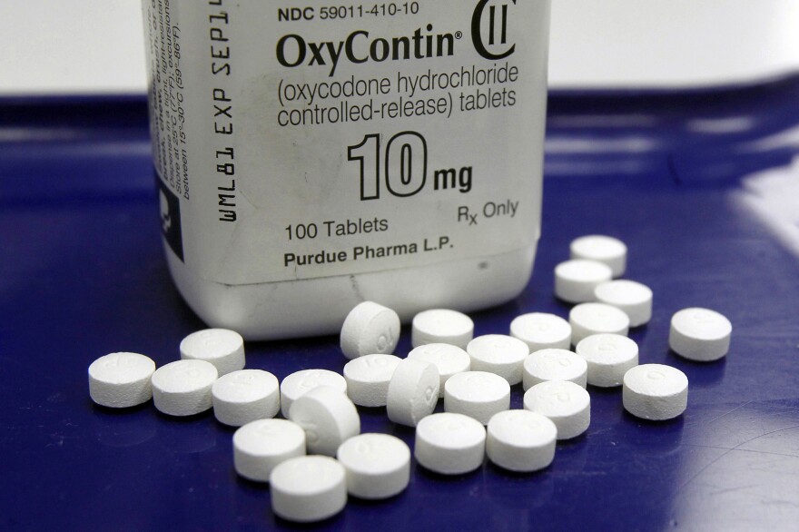 A federal judge says work to implement the controversial bankruptcy deal for Oxycontin-maker Purdue Pharma may continue.