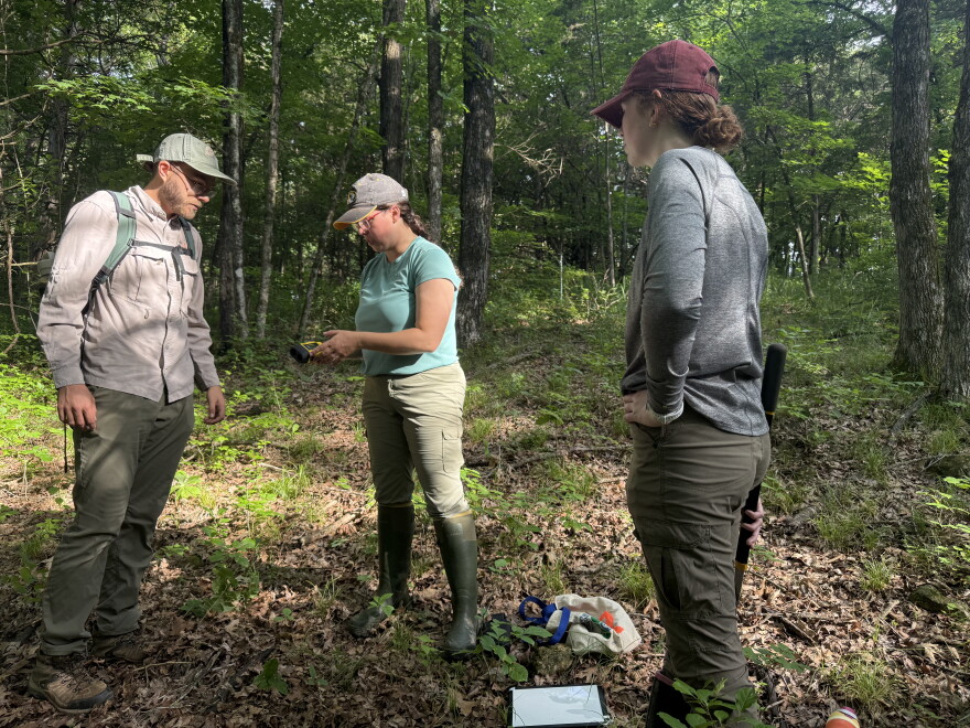Christine Brodsky demonstrates how to use a wildlife camera to graduate research assistant Adar Reed.