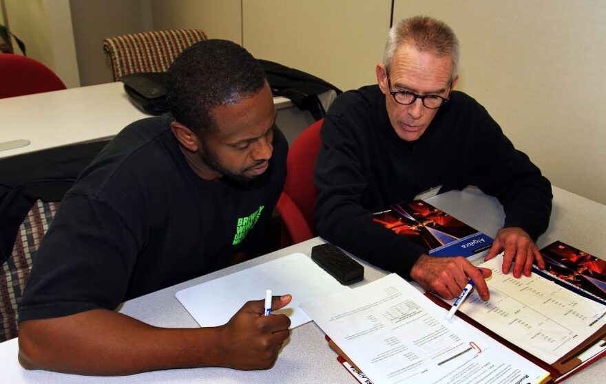 A Literacy Services of Wisconsin tutor works with an adult student.