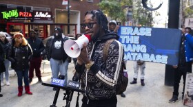 Kraig Lewis at a November 2022 rally outside New York City's Department of Investigation. Lewis and other activists want the DOI to release a report that looks into the Controversial police department's gang database. (Carolina Hidalgo/WNYC)