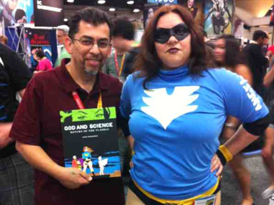 <em>Love and Rockets</em> author Jaime Hernandez, with a fan dressed as Boot Angel, one of the characters in <em>God and Science</em>.
