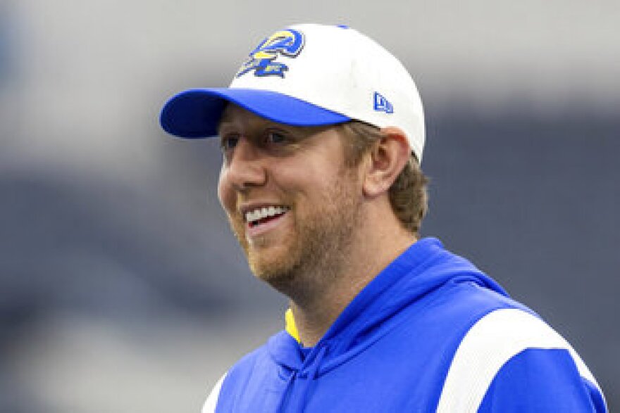FILE - Los Angeles Rams offensive coordinator Liam Coen coaches players before the Rams play against the Seattle Seahawks in an NFL football game, Sunday, Dec. 4, 2022, in Inglewood, Calif. Kentucky coach Mark Stoops has re-hired former Los Angeles Rams assistant Liam Coen as offensive coordinator and quarterbacks coach, returning him to the program he built into one of the SEC’s top attacks in 2021. (AP Photo/Jeff Lewis, File)