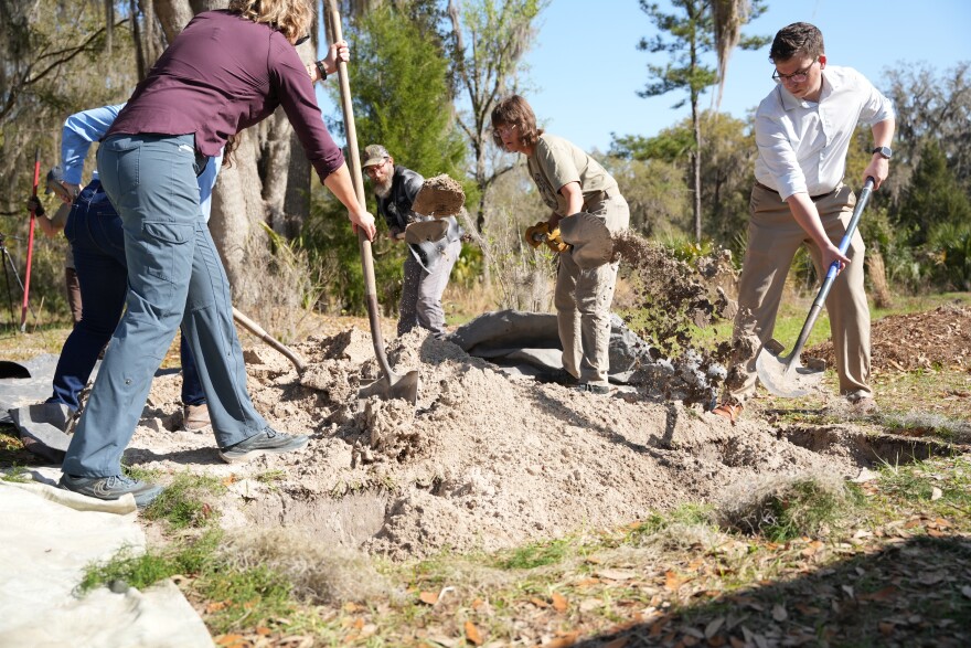 Following the conclusion of the memorial, families are brought in to participate in the burial process. This allows for a unique and intimate celebration of deceased loved ones. (Alexis Vivanco/WUFT News)