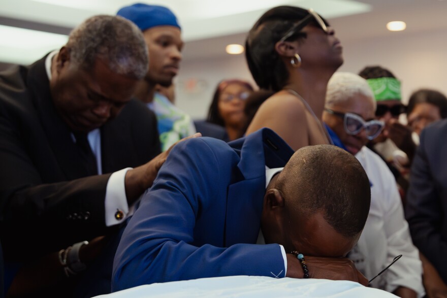 Samuel Hayes Sr. collapses on the casket of his son Samuel Hayes Jr. during his funeral service at Layne Renaissance Chapel on Thursday, Aug. 21, 2025, in Jennings.