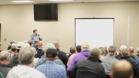 Trevor Ahring, an engineer for Groundwater Management District 3, presents water declines in the region and the group’s plan to reduce water use.