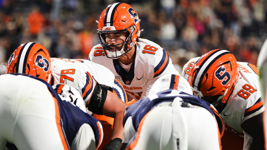 Syracuse quarterback Malachi Nelson (16, White) goes under center in SU’s loss to Virginia Saturday.