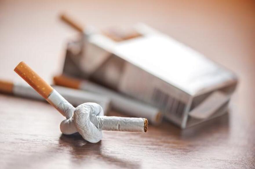 A photo of a cigarette tied into a knot