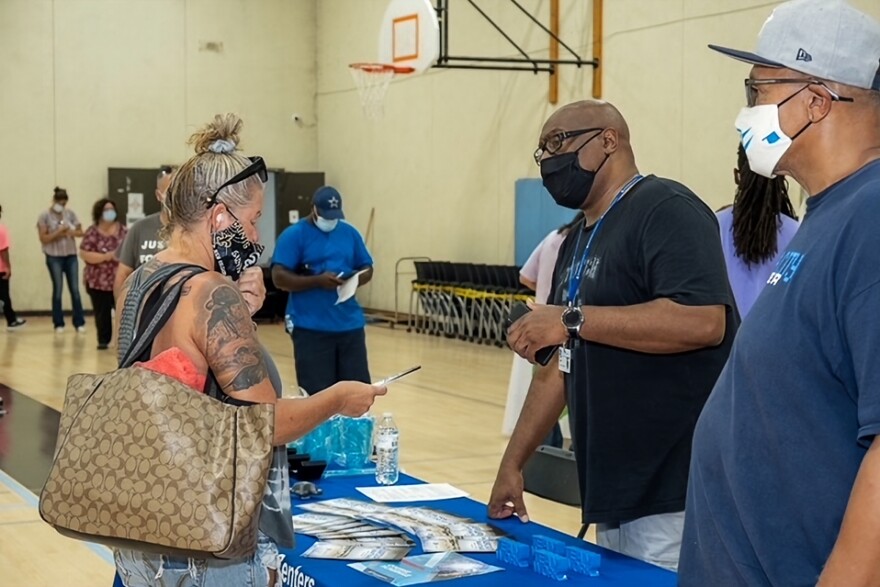 A representative from MetroTech provides information to an attendee of the Urban League of Greater Oklahoma City's expungement fair on August 21, 2021.