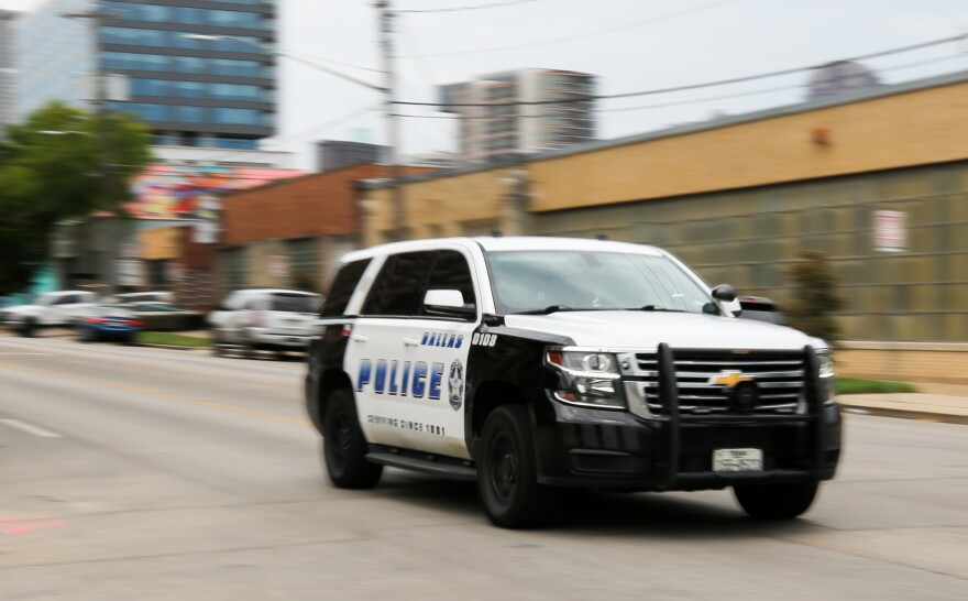 Dallas Police vehicle rolls down a street Tuesday, July 11, 2023, in Dallas.