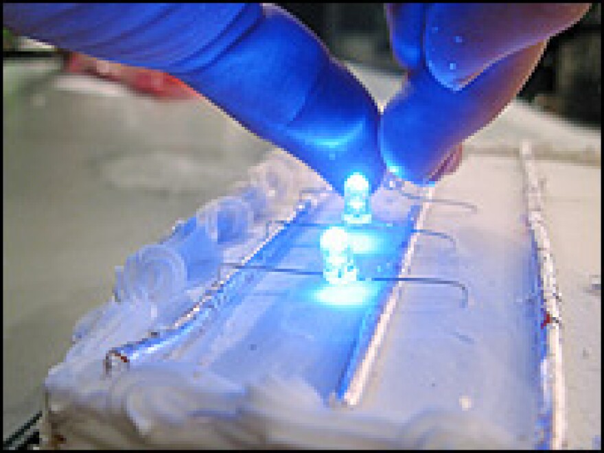 Putting LEDs on a cake.