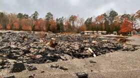 The aftermath of the multi-day fire left the parking lot behind the Williamsburg Premium Outlets collapsed and crumbled.