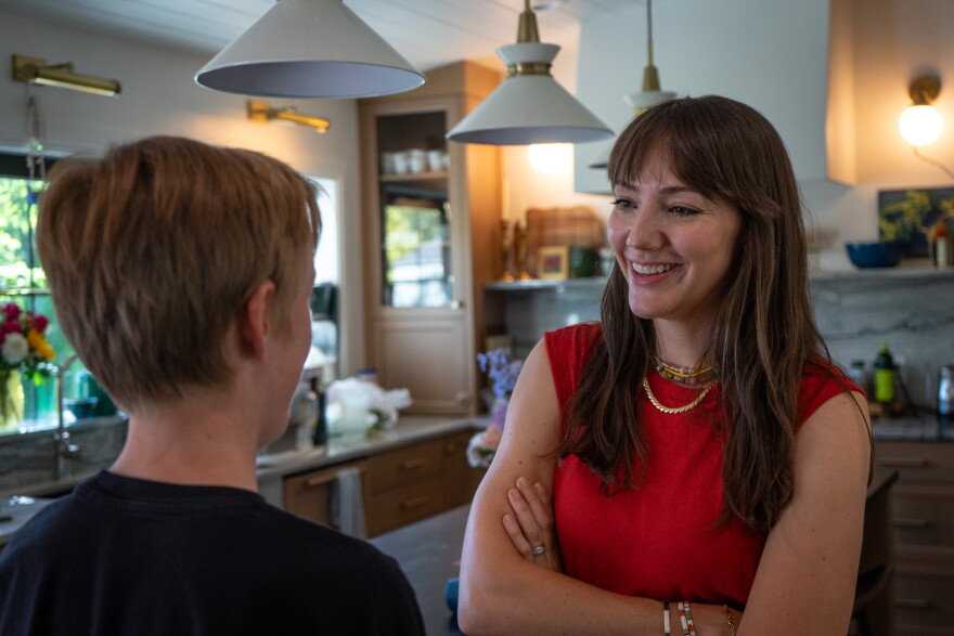 After getting home from drum lessons, one of the Packer kids talks to his mom.