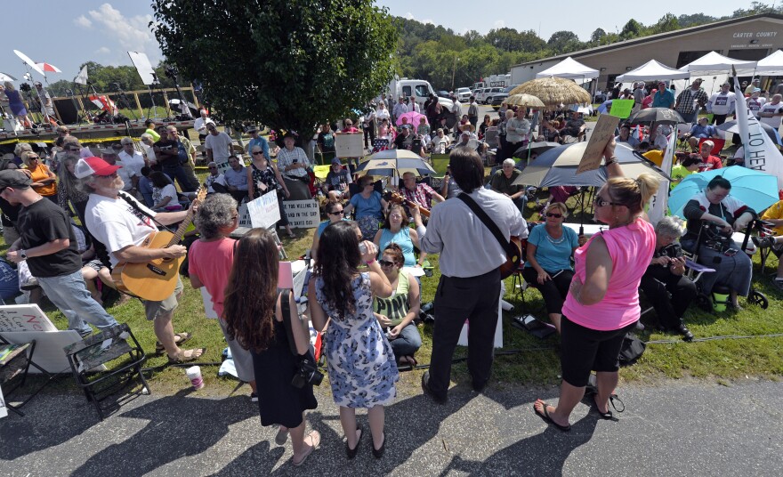 Musicians lead protesters in hymns outside the Carter County Detention Center in Grayson, Ky., on Tuesday.