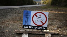 In this Tuesday, May 28, 2019 photo a sign protests Central Maine Power's controversial hydropower transmission corridor near Jackman, Maine. 