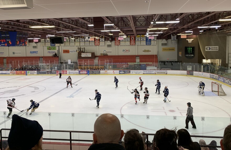 Players fight for the puck at the Kenai/Nikiski and SoHi/Skyview alumni hockey game at the Soldotna Regional Sports Complex on Friday, Dec. 22, 2023, in Soldotna, Alaska.