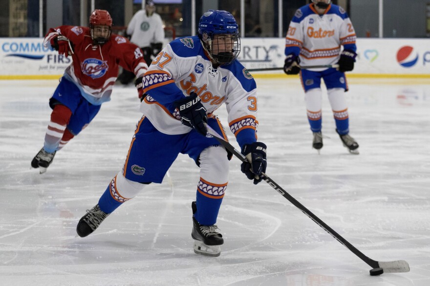 Joshua Orsey controlling the puck in a game.