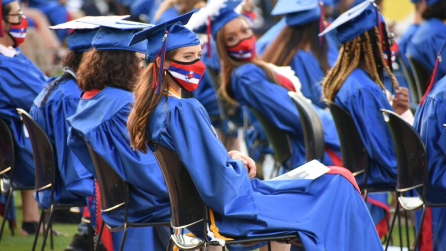 A high school graduation ceremony in South Bend, held outside due to COVID-19 safety precautions.