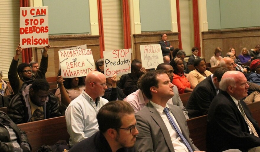 Members of Missourians Organizing for Reform and Empowerment conduct a silent protest during a public hearing on municipal court reform in 2015.