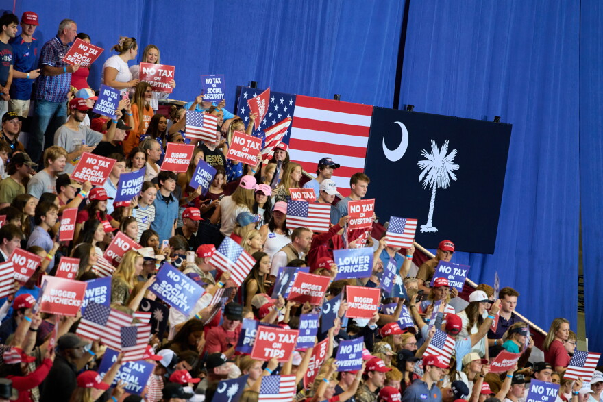 People cheer before President Donald Trump's campaign rally speech at Clemson University's T. Ed Garrison Arena, Wednesday, Oct. 21, 2026, in Pendleton, S.C.