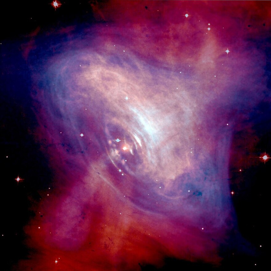 Composite image of the Crab Nebula showing the X-ray (blue), and optical (red) images superimposed.