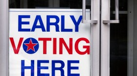 An early voting sign welcoming people to vote.