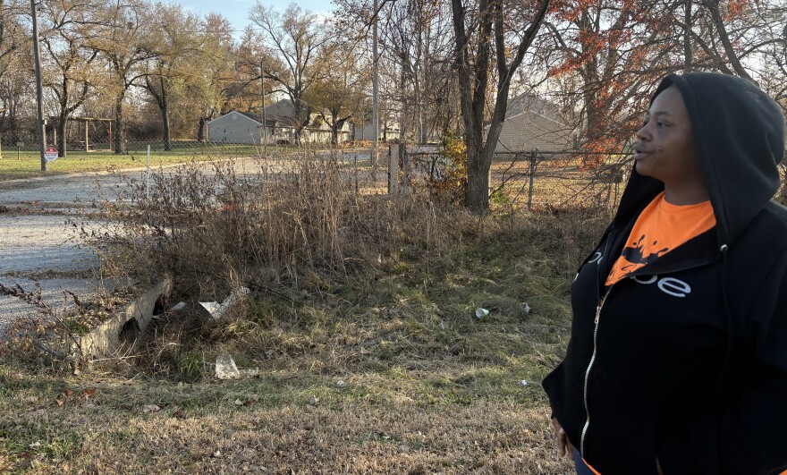 Candice Montgomery stands outside the closed Aspen Place apartment complex in Gardner, Kansas. She is one of hundreds of former residents who were kicked out of their homes when the City of Gardner condemned the property.