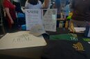 Heal Palestine merchandise is displayed at a pickleball fundraiser organized by Charlotte United for Palestine at Tipsy Pickle in Charlotte on July 19, 2026. Proceeds benefit grief and trauma support for orphaned children in Gaza.