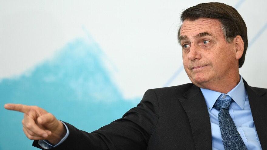 Brazilian President Jair Bolsonaro attends an International Youth Day celebration in Brasília last week. Deforestation in the Amazon has soared since the far-right leader took office in January.